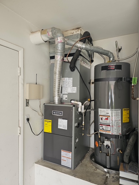 Maytag furnace and water heater installed in utility room